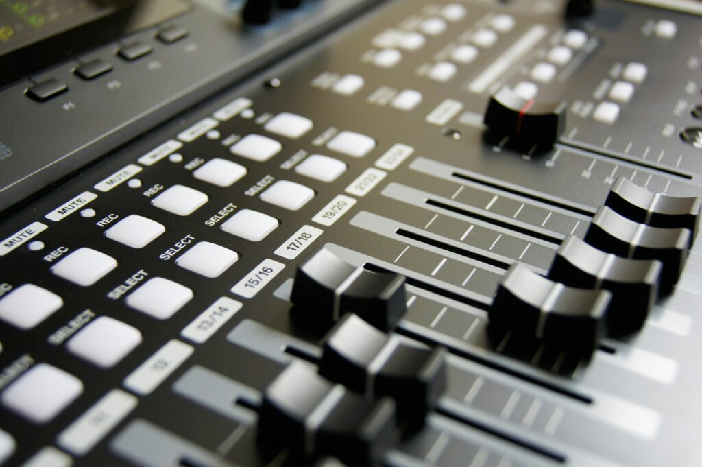 mixing-table-mixing-music-musician-159206-159206 Detailed view of audio mixer sliders and buttons for sound engineering and music production.