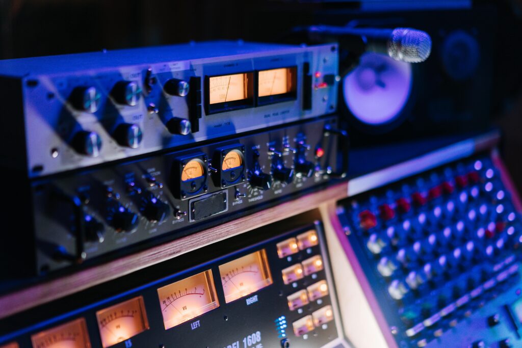 pexels-photo-7087606-7087606 Professional music studio featuring sophisticated audio equipment and mixing console, ideal for high-quality sound production.